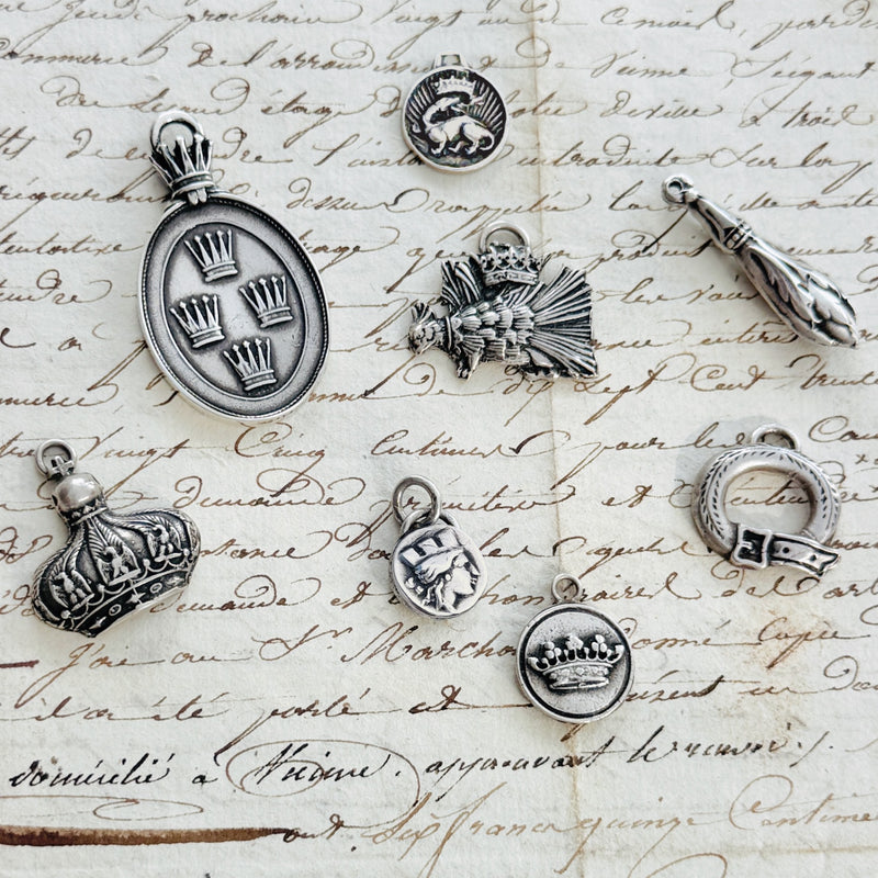 Regal & Heraldic Charms — Symbols of Nobility, Protection & Devotion