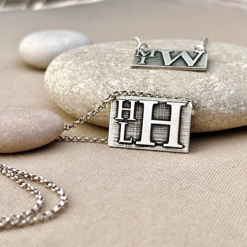 Rectangle necklace with name 2025 on it